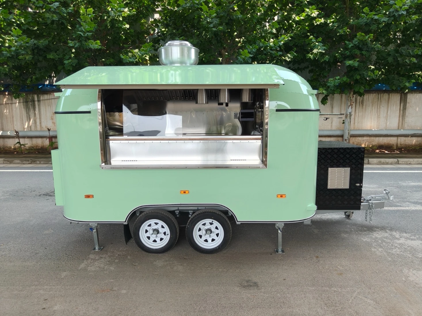 The real mint-green Buttersome trailer with its serving window open